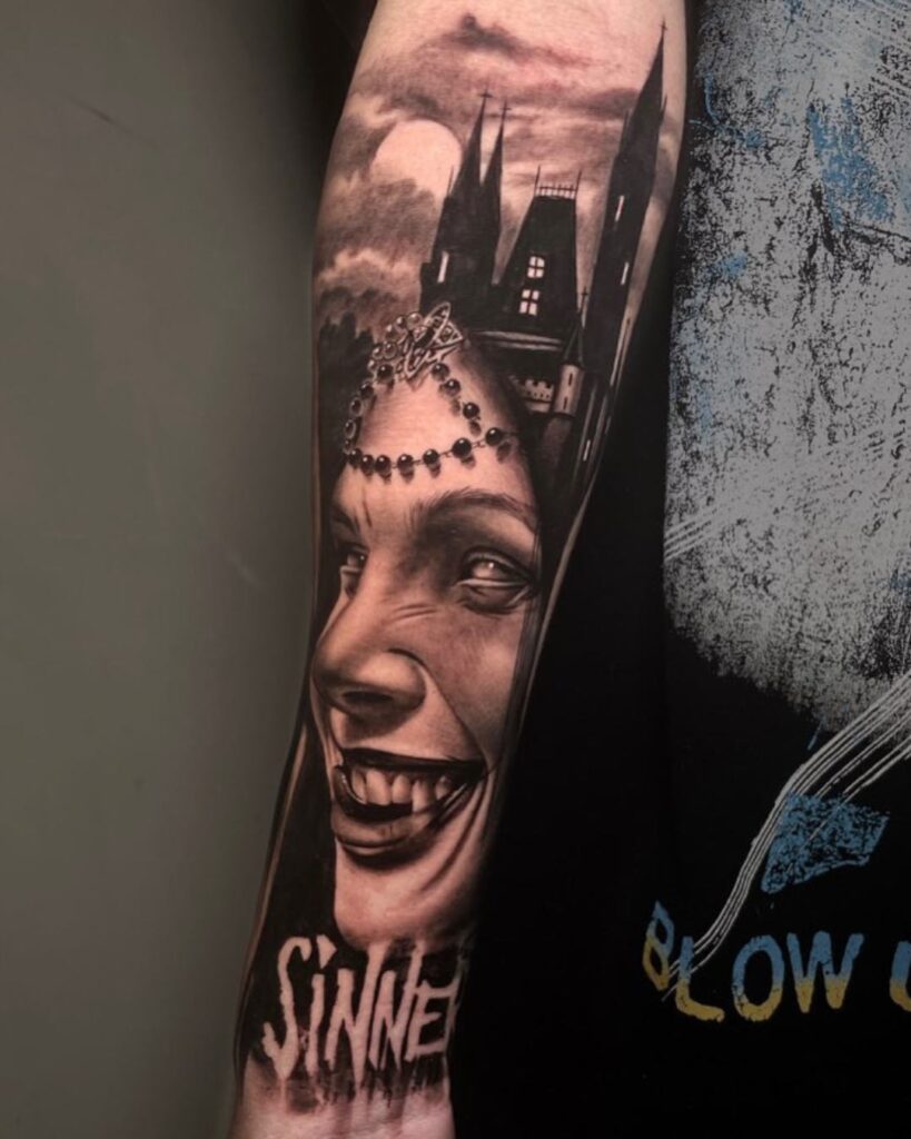 Black and grey forearm tattoo that shows a spooky castle in the background and a woman's face laughing with the word 'sinner' below. 