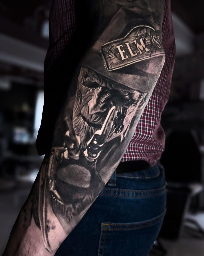 Iconic Halloween tattoos: A black and gray portrait of Freddie Krueger from Nightmare on Elm Street.  