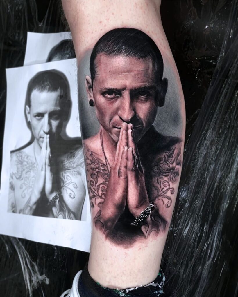 A black and grey portrait tattoo of Linkin Park singer Chester Bennington